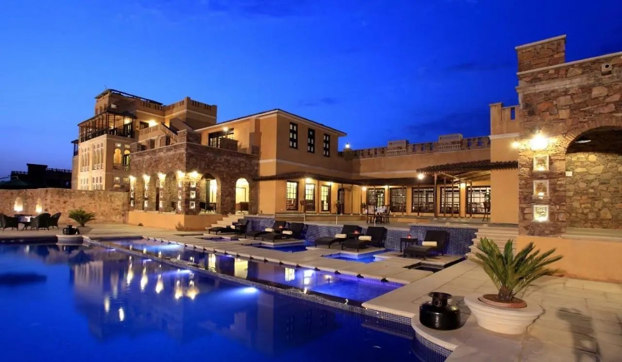 Resort exterior at dusk – Juna Mahal Resort Ranthambore